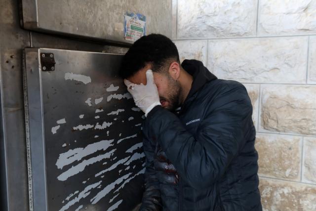 (260302) -- NABLUS, March 2, 2026 (Xinhua) -- A Palestinian mourns for his relative, who was killed by Israeli settlers, at a hospital in Nablus, the northern West Bank, on March 2, 2026. Two Palestinian men were shot dead on Monday by Israeli settlers in the southern area of the West Bank city of Nablus, the Ramallah-based Palestinian health ministry said. (Photo by Nidal Eshtayeh/Xinhua)