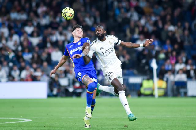 (260303) -- MADRID, March 3, 2026 (Xinhua) -- Real Madrid's Antonio Rudiger (R) vies with Getafe's Luis Vazquez during the La Liga football match between Real Madrid and Getafe CF in Madrid, Spain, on March 2, 2026. (Photo by Gustavo Valiente/Xinhua)
