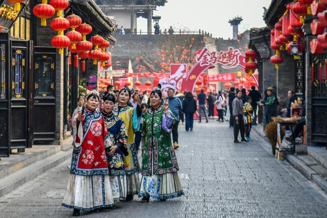 (260303) -- JINZHONG, March 3, 2026 (Xinhua) -- Tourists visit Pingyao ancient town in Jinzhong, north China's Shanxi Province, Feb. 27, 2026.
  Various activities are held in Shanxi Province to celebrate the Lantern Festival, which falls on the fifteenth day of the first month of the Chinese lunar calendar, or March 3 this year. (Xinhua/Cao Yang)