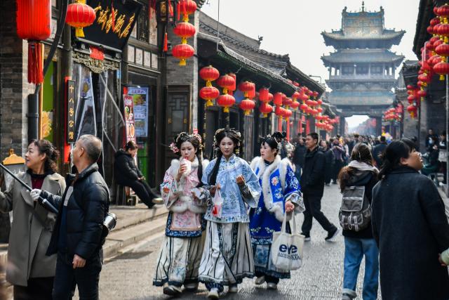 (260303) -- JINZHONG, March 3, 2026 (Xinhua) -- Tourists visit Pingyao ancient town in Jinzhong, north China's Shanxi Province, Feb. 27, 2026.
  Various activities are held in Shanxi Province to celebrate the Lantern Festival, which falls on the fifteenth day of the first month of the Chinese lunar calendar, or March 3 this year. (Xinhua/Cao Yang)