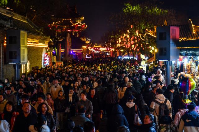 (260303) -- JINZHONG, March 3, 2026 (Xinhua) -- Tourists visit the ancient city of Yuci in Jinzhong, north China's Shanxi Province, March 2, 2026.
  Various activities are held in Shanxi Province to celebrate the Lantern Festival, which falls on the fifteenth day of the first month of the Chinese lunar calendar, or March 3 this year. (Xinhua/Cao Yang)