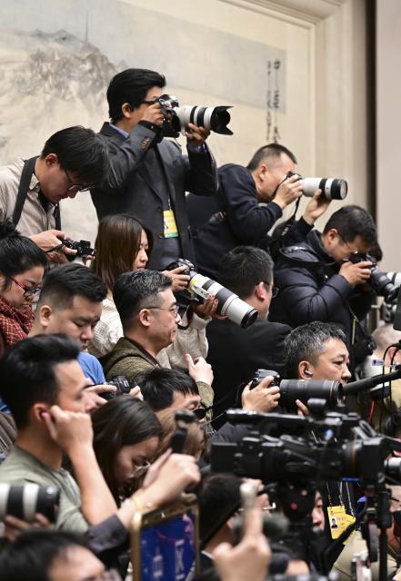 (260303) -- BEIJING, March 3, 2026 (Xinhua) -- Journalists work at a press conference of the fourth session of the 14th Chinese People's Political Consultative Conference (CPPCC) National Committee at the Great Hall of the People in Beijing, capital of China, March 3, 2026. The CPPCC National Committee, China's top political advisory body, held a press conference on Tuesday, one day before its annual session. (Xinhua/Chen Yehua)