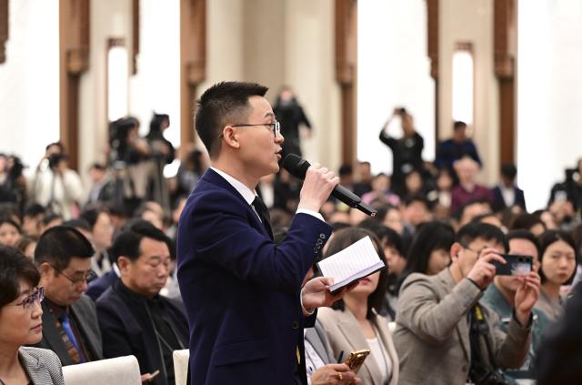 (260303) -- BEIJING, March 3, 2026 (Xinhua) -- A journalist asks a question at a press conference of the fourth session of the 14th Chinese People's Political Consultative Conference (CPPCC) National Committee at the Great Hall of the People in Beijing, capital of China, March 3, 2026. The CPPCC National Committee, China's top political advisory body, held a press conference on Tuesday, one day before its annual session. (Xinhua/Chen Yehua)