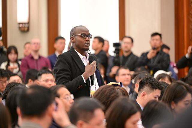 (260303) -- BEIJING, March 3, 2026 (Xinhua) -- A journalist asks a question at a press conference of the fourth session of the 14th Chinese People's Political Consultative Conference (CPPCC) National Committee at the Great Hall of the People in Beijing, capital of China, March 3, 2026. The CPPCC National Committee, China's top political advisory body, held a press conference on Tuesday, one day before its annual session. (Xinhua/Chen Yehua)