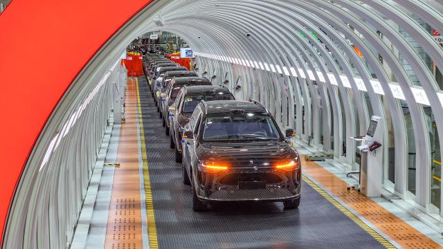 (260303) -- BEIJING, March 3, 2026 (Xinhua) -- A drone photo shows new energy vehicles at the Seres Super Factory in Liangjiang New Area, southwest China's Chongqing, Sept. 19, 2025. (Xinhua/Wang Quanchao)