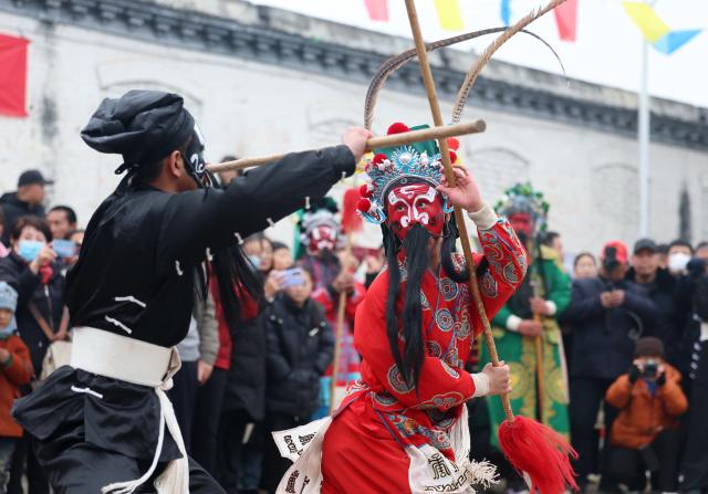 (260303) -- BEIJING, March 3, 2026 (Xinhua) -- Folk artists perform during a Shehuo gala in Taolinping Village, Jingxing County, north China's Hebei Province, March 3, 2026. Across China, a variety of vibrant activities were held in celebration of the Lantern Festival, which falls on the fifteenth day of the first month of the Chinese lunar calendar, or March 3 this year. (Xinhua/Yang Shiyao)