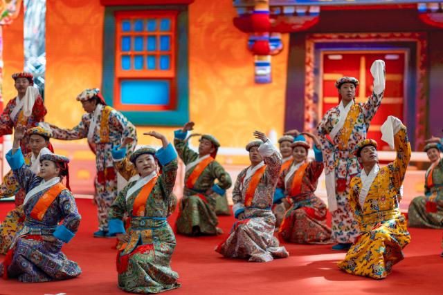 (260303) -- BEIJING, March 3, 2026 (Xinhua) -- Folk dancers perform in celebration of the Lantern Festival in Lhasa, southwest China's Xizang Autonomous Region, March 3, 2026. Across China, a variety of vibrant activities were held in celebration of the Lantern Festival, which falls on the fifteenth day of the first month of the Chinese lunar calendar, or March 3 this year. (Xinhua/Jiang Fan)
