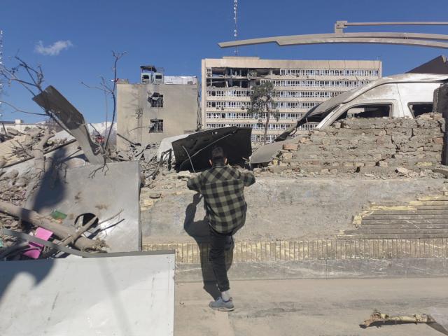 (260303) -- TEHRAN, March 3, 2026 (Xinhua) -- A man checks the debris in Tehran, Iran, March 3, 2026.
  The joint U.S.-Israel military operation against Iran entered its fourth day.
   The death toll in Iran rose to 787, according to the Iranian Red Crescent. (Xinhua/Shadati)