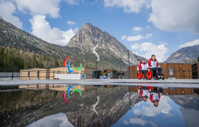 (260303) -- CORTINA D'AMPEZZO, March 3, 2026 (Xinhua) -- Chen Jianxin (R) and Wang Haitao of China are seen at the Paralympic Village of the Milan-Cortina 2026 Paralympic Winter Games in Cortina d'Ampezzo, Italy, March 3, 2026. (Xinhua/Lian Zhen)