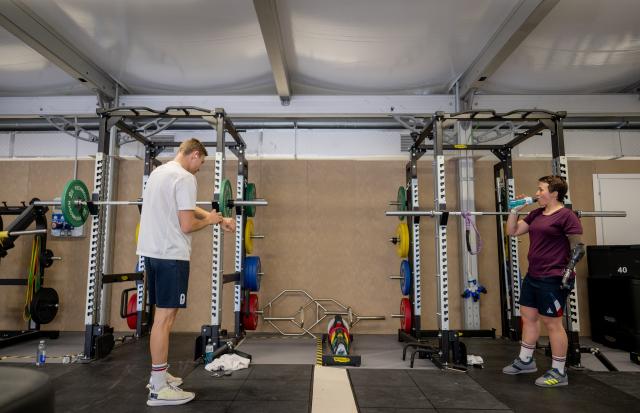 (260303) -- CORTINA D'AMPEZZO, March 3, 2026 (Xinhua) -- Athletes work out in the fitness center at the Paralympic Village of the Milan-Cortina 2026 Paralympic Winter Games in Cortina d'Ampezzo, Italy, March 3, 2026. (Xinhua/Lian Zhen)