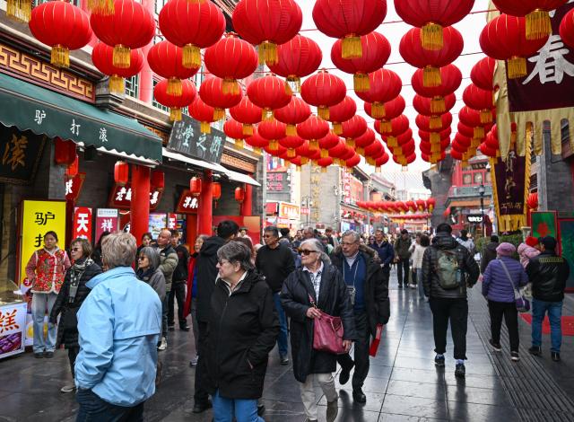 (260303) -- TIANJIN, March 3, 2026 (Xinhua) -- Inbound tourists visit an ancient cultural street in Tianjin, north China, March 3, 2026.
  As the first visiting cruise in northern China this year, MS Regatta, a cruise ship operated by Oceania Cruises, arrived at Tianjin International Cruise Home Port from South Korea on Tuesday.
   The nearly 600 passengers aboard MS Regatta, who came from over 20 countries and regions including the United States, Canada and Australia, embarked on a two-day itinerary to experience Tianjin's cultural charm and historical grandeur. (Xinhua/Sun Fanyue)