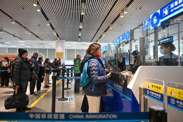 (260303) -- TIANJIN, March 3, 2026 (Xinhua) -- Passengers line up for immigration procedures at Tianjin International Cruise Home Port in Tianjin, north China, March 3, 2026.
  As the first visiting cruise in northern China this year, MS Regatta, a cruise ship operated by Oceania Cruises, arrived at Tianjin International Cruise Home Port from South Korea on Tuesday.
   The nearly 600 passengers aboard MS Regatta, who came from over 20 countries and regions including the United States, Canada and Australia, embarked on a two-day itinerary to experience Tianjin's cultural charm and historical grandeur. (Xinhua/Sun Fanyue)