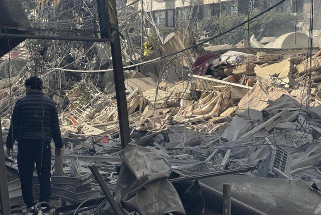 (260303) -- BEIRUT, March 3, 2026 (Xinhua) -- A man checks the rubble after Israel's overnight bombing of Beirut's southern suburbs, March 3, 2026. Two members of the Islamic Health Authority were killed on Tuesday in an Israeli airstrike on the southern Lebanese town of Siddiqine, the state-run National News Agency (NNA) reported.
   The escalation extended beyond the border region to Beirut's southern suburbs, where Israeli warplanes carried out a new series of intense airstrikes without prior warning, causing significant damage to targeted buildings, NNA said. (Photo by Bilal Jawich/Xinhua)