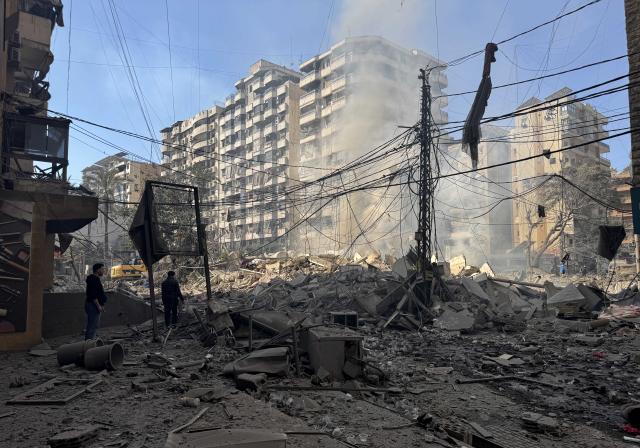 (260303) -- BEIRUT, March 3, 2026 (Xinhua) -- People check the rubble after Israel's overnight bombing of Beirut's southern suburbs, March 3, 2026. Two members of the Islamic Health Authority were killed on Tuesday in an Israeli airstrike on the southern Lebanese town of Siddiqine, the state-run National News Agency (NNA) reported.
   The escalation extended beyond the border region to Beirut's southern suburbs, where Israeli warplanes carried out a new series of intense airstrikes without prior warning, causing significant damage to targeted buildings, NNA said. (Photo by Bilal Jawich/Xinhua)