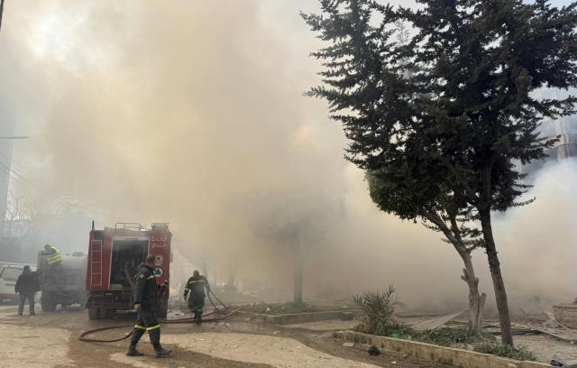 (260303) -- BEIRUT, March 3, 2026 (Xinhua) -- Rescue workers are pictured during search and rescue operations after Israel's overnight bombing of Beirut's southern suburbs, March 3, 2026. Two members of the Islamic Health Authority were killed on Tuesday in an Israeli airstrike on the southern Lebanese town of Siddiqine, the state-run National News Agency (NNA) reported.
   The escalation extended beyond the border region to Beirut's southern suburbs, where Israeli warplanes carried out a new series of intense airstrikes without prior warning, causing significant damage to targeted buildings, NNA said. (Photo by Bilal Jawich/Xinhua)