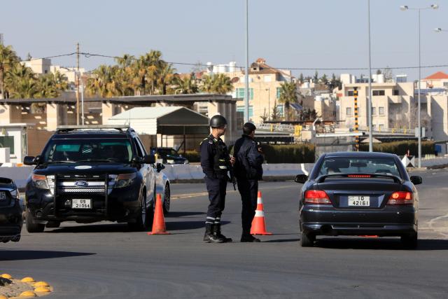 (260303) -- AMMAN, March 3, 2026 (Xinhua) -- Jordanian policemen block the area and roads surrounding the U.S. embassy in Amman, Jordan on March 3, 2026. All personnel at the U.S. Embassy in Amman have temporarily departed the embassy compound due to a security threat, the embassy said in a statement on Monday. (Photo by Mohammad Abu Ghosh/Xinhua)