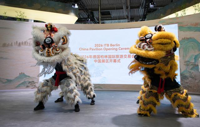 (260303) -- BERLIN, March 3, 2026 (Xinhua) -- Artists perform lion dance during the China Pavilion Opening Ceremony at the ITB Berlin travel trade show in Berlin, Germany on March 3, 2026. This year's ITB Berlin travel trade show kicked off here on Tuesday and will last until March 5. First held in 1966, the event celebrates its 60th anniversary this year. (Xinhua/Zhang Haofu)