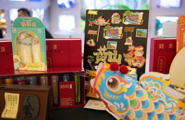 (260303) -- BERLIN, March 3, 2026 (Xinhua) -- Cultural creative products are pictured at the exhibition area of Huangshan City at the ITB Berlin travel trade show in Berlin, Germany on March 3, 2026. This year's ITB Berlin travel trade show kicked off here on Tuesday and will last until March 5. First held in 1966, the event celebrates its 60th anniversary this year. (Xinhua/Zhang Haofu)