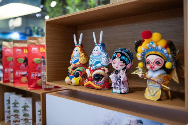 (260303) -- BERLIN, March 3, 2026 (Xinhua) -- Cultural creative products are pictured at the exhibition area of Beijing in China Pavilion at the ITB Berlin travel trade show in Berlin, Germany on March 3, 2026. This year's ITB Berlin travel trade show kicked off here on Tuesday and will last until March 5. First held in 1966, the event celebrates its 60th anniversary this year. (Xinhua/Zhang Haofu)