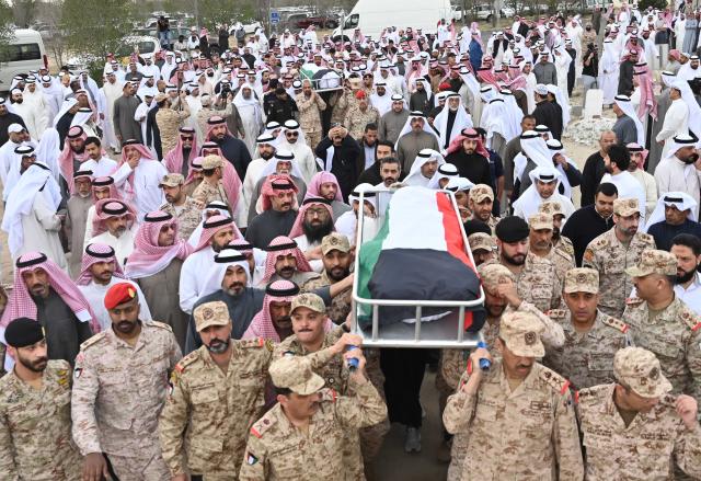 (260303) -- CAPITAL GOVERNORATE, March 3, 2026 (Xinhua) -- People participate in the funerals of two Kuwaiti naval service members in Capital Governorate, Kuwait, March 3, 2026. The two Kuwaiti naval service members were killed in the past few days while performing the duty as part of the national missions entrusted to the armed forces. (Photo by Asad/Xinhua)