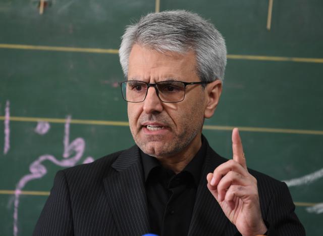 (260303) -- TEHRAN, March 3, 2026 (Xinhua) -- Iranian Foreign Ministry spokesman Esmaeil Baghaei speaks during a weekly press conference held in a war-damaged school in Tehran, Iran, on March 3, 2026. Baghaei on Tuesday warned about bids by Israel to expand the scope of the war with Iran to the entire West Asia region. (Xinhua/Shadati)