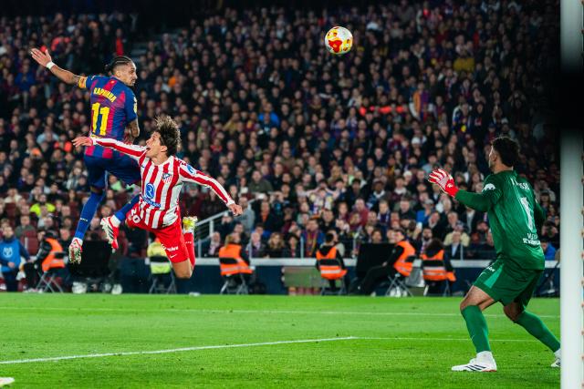 (260304) -- BARCELONA, March 4, 2026 (Xinhua) -- Raphinha of FC Barcelona (L) vies for a header with Giuliano Simeone of Atletico de Madrid during the Copa del Rey semifinal round 2 match between FC Barcelona and  Atletico de Madrid in Barcelona, Spain, March 3, 2026. (Photo by Joan Gosa/Xinhua)