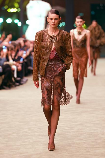 (260304) -- PARIS, March 4, 2026 (Xinhua) -- A model presents a creation from the ready-to-wear Fall/Winter 2026-2027 collections by Saint Laurent during the Paris Fashion Week in Paris, France, on March 3, 2026. (MeetEurope/Handout via Xinhua)