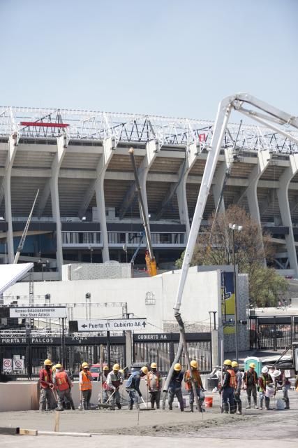(260304) -- MEXICO CITY, March 4, 2026 (Xinhua) -- Construction workers work at the Azteca Stadium in Mexico City, Mexico, March 3, 2026. The expanded 48-team World Cup, to be co-hosted by the United States, Canada, and Mexico, will run from June 11 to July 19, 2026. Mexico City's iconic Azteca Stadium, which staged the 1970 and 1986 World Cup finals, will host the opener and four other matches in the next edition of football's showpiece tournament. (Photo by Francisco Canedo/Xinhua)
