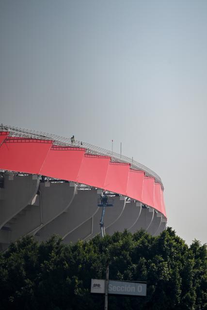 (260304) -- MEXICO CITY, March 4, 2026 (Xinhua) -- Construction workers work at the Azteca Stadium in Mexico City, Mexico, March 3, 2026. The expanded 48-team World Cup, to be co-hosted by the United States, Canada, and Mexico, will run from June 11 to July 19, 2026. Mexico City's iconic Azteca Stadium, which staged the 1970 and 1986 World Cup finals, will host the opener and four other matches in the next edition of football's showpiece tournament. (Xinhua/Li Muzi)