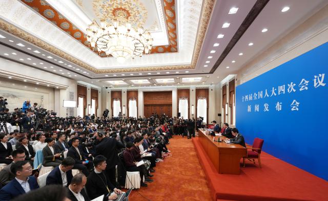 (260304) -- BEIJING, March 4, 2026 (Xinhua) -- Lou Qinjian, spokesperson for the fourth session of the 14th National People's Congress (NPC), attends a press conference at the Great Hall of the People in Beijing, capital of China, March 4, 2026. The NPC, China's national legislature, held a press conference on Wednesday, one day ahead of the opening of its annual session. (Xinhua/Xing Guangli)