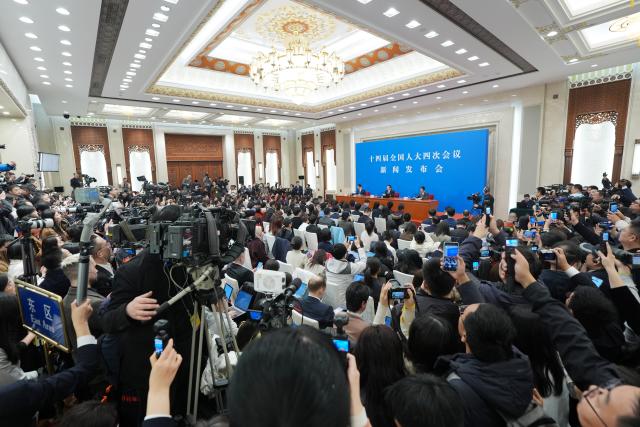 (260304) -- BEIJING, March 4, 2026 (Xinhua) -- Lou Qinjian, spokesperson for the fourth session of the 14th National People's Congress (NPC), attends a press conference at the Great Hall of the People in Beijing, capital of China, March 4, 2026. The NPC, China's national legislature, held a press conference on Wednesday, one day ahead of the opening of its annual session. (Xinhua/Wang Xi)
