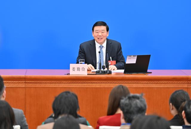 (260304) -- BEIJING, March 4, 2026 (Xinhua) -- Lou Qinjian, spokesperson for the fourth session of the 14th National People's Congress (NPC), attends a press conference at the Great Hall of the People in Beijing, capital of China, March 4, 2026. The NPC, China's national legislature, held a press conference on Wednesday, one day ahead of the opening of its annual session. (Xinhua/Li Xin)
