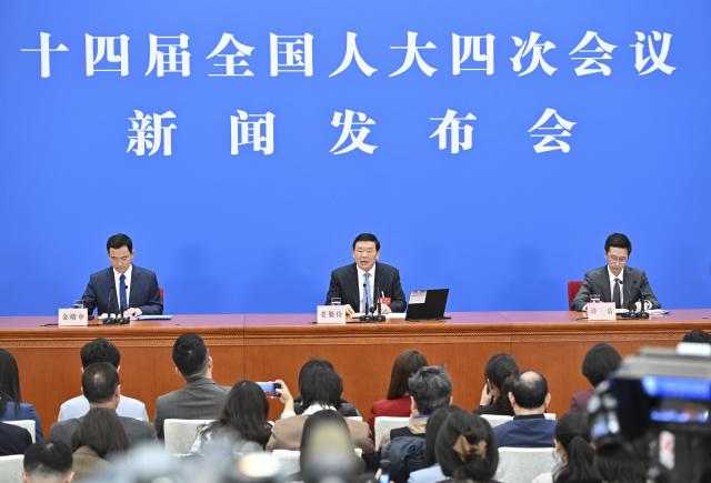 (260304) -- BEIJING, March 4, 2026 (Xinhua) -- Lou Qinjian, spokesperson for the fourth session of the 14th National People's Congress (NPC), attends a press conference at the Great Hall of the People in Beijing, capital of China, March 4, 2026. The NPC, China's national legislature, held a press conference on Wednesday, one day ahead of the opening of its annual session. (Xinhua/Li Xin)