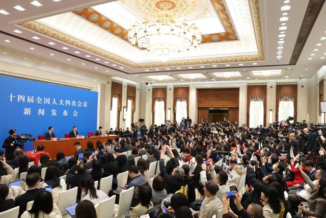 (260304) -- BEIJING, March 4, 2026 (Xinhua) -- Lou Qinjian, spokesperson for the fourth session of the 14th National People's Congress (NPC), attends a press conference at the Great Hall of the People in Beijing, capital of China, March 4, 2026. The NPC, China's national legislature, held a press conference on Wednesday, one day ahead of the opening of its annual session. (Xinhua/Jin Liwang)