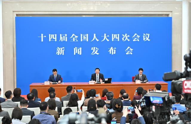 (260304) -- BEIJING, March 4, 2026 (Xinhua) -- Lou Qinjian, spokesperson for the fourth session of the 14th National People's Congress (NPC), attends a press conference at the Great Hall of the People in Beijing, capital of China, March 4, 2026. The NPC, China's national legislature, held a press conference on Wednesday, one day ahead of the opening of its annual session. (Xinhua/Li Xin)