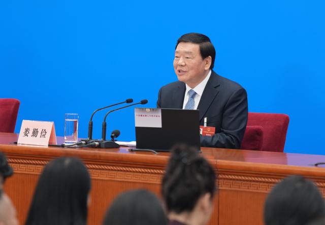 (260304) -- BEIJING, March 4, 2026 (Xinhua) -- Lou Qinjian, spokesperson for the fourth session of the 14th National People's Congress (NPC), attends a press conference at the Great Hall of the People in Beijing, capital of China, March 4, 2026. The NPC, China's national legislature, held a press conference on Wednesday, one day ahead of the opening of its annual session. (Xinhua/Wang Xi)