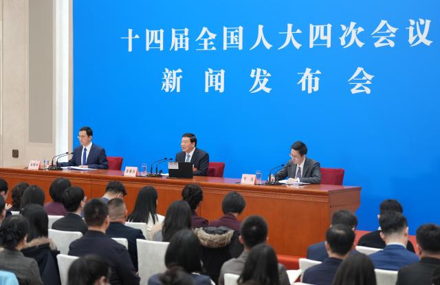 (260304) -- BEIJING, March 4, 2026 (Xinhua) -- Lou Qinjian, spokesperson for the fourth session of the 14th National People's Congress (NPC), attends a press conference at the Great Hall of the People in Beijing, capital of China, March 4, 2026. The NPC, China's national legislature, held a press conference on Wednesday, one day ahead of the opening of its annual session. (Xinhua/Wang Xi)