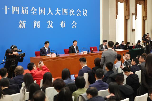 (260304) -- BEIJING, March 4, 2026 (Xinhua) -- Lou Qinjian, spokesperson for the fourth session of the 14th National People's Congress (NPC), attends a press conference at the Great Hall of the People in Beijing, capital of China, March 4, 2026. The NPC, China's national legislature, held a press conference on Wednesday, one day ahead of the opening of its annual session. (Xinhua/Jin Liwang)