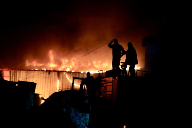 (260304) -- SIDON, March 4, 2026 (Xinhua) -- Rescuers work at the site of the Islamic Group's offices destroyed by Israeli airstrikes in Sidon, southern Lebanon, March 3, 2026. (Photo by Ali Hashisho/Xinhua)