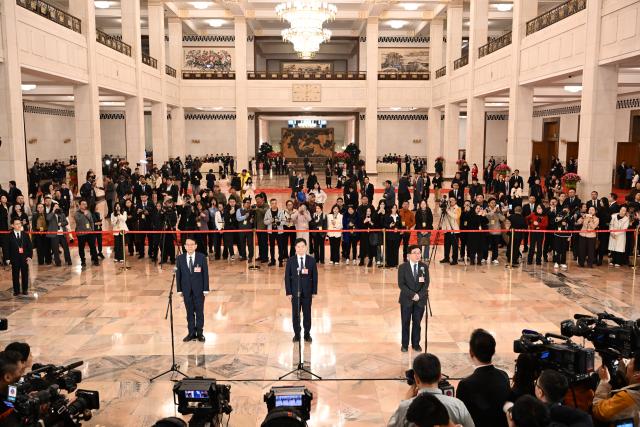 (260304) -- BEIJING, March 4, 2026 (Xinhua) -- Members of the 14th National Committee of the Chinese People's Political Consultative Conference (CPPCC) attend a group interview ahead of the opening meeting of the fourth session of the 14th CPPCC National Committee at the Great Hall of the People in Beijing, capital of China, March 4, 2026. (Xinhua/Cao Yiming)