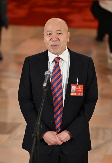 (260304) -- BEIJING, March 4, 2026 (Xinhua) -- Wang Yongfeng, a member of the 14th National Committee of the Chinese People's Political Consultative Conference (CPPCC), attends a group interview ahead of the opening meeting of the fourth session of the 14th CPPCC National Committee at the Great Hall of the People in Beijing, capital of China, March 4, 2026. (Xinhua/Cao Yiming)