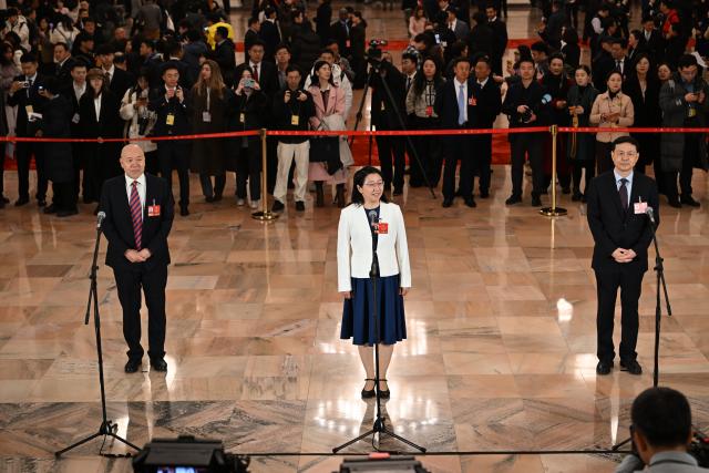 (260304) -- BEIJING, March 4, 2026 (Xinhua) -- Members of the 14th National Committee of the Chinese People's Political Consultative Conference (CPPCC) attend a group interview ahead of the opening meeting of the fourth session of the 14th CPPCC National Committee at the Great Hall of the People in Beijing, capital of China, March 4, 2026. (Xinhua/Cao Yiming)