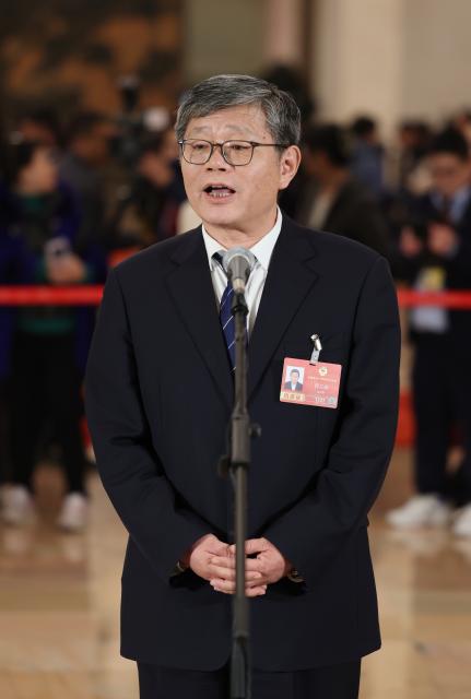 (260304) -- BEIJING, March 4, 2026 (Xinhua) -- Guo Lanfeng, a member of the 14th National Committee of the Chinese People's Political Consultative Conference (CPPCC), attends a group interview ahead of the opening meeting of the fourth session of the 14th CPPCC National Committee at the Great Hall of the People in Beijing, capital of China, March 4, 2026. (Xinhua/Lu Ye)