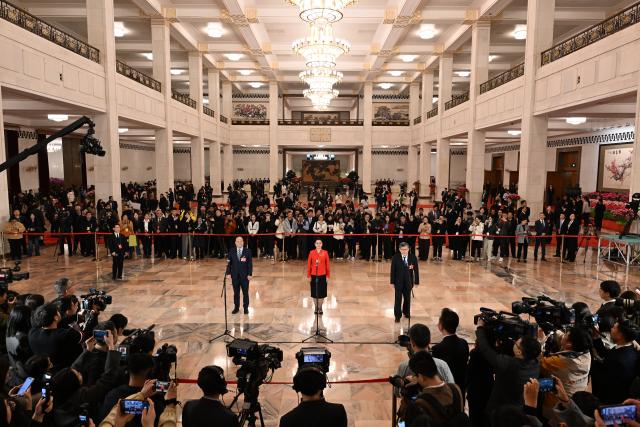 (260304) -- BEIJING, March 4, 2026 (Xinhua) -- Members of the 14th National Committee of the Chinese People's Political Consultative Conference (CPPCC) attend a group interview ahead of the opening meeting of the fourth session of the 14th CPPCC National Committee at the Great Hall of the People in Beijing, capital of China, March 4, 2026. (Xinhua/Cao Yiming)