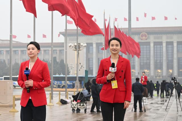 (260304) -- BEIJING, March 4, 2026 (Xinhua) -- Journalists work on Tian'anmen Square ahead of the opening meeting of the fourth session of the 14th Chinese People's Political Consultative Conference (CPPCC) National Committee in Beijing, capital of China, March 4, 2026. (Xinhua/Jin Liangkuai)