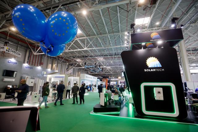 (260304) -- BUCHAREST, March 4, 2026 (Xinhua) -- People visit the Green Energy Expo & Romenvirotec event at Romexpo in Bucharest, Romania, March 3, 2026.
  The event is a regional platform for technologies in green energy, water, waste and sustainable cities. (Photo by Cristian Cristel/Xinhua)
