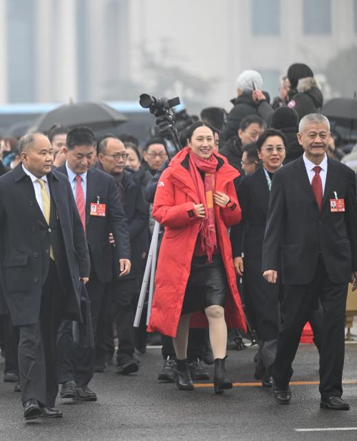 (260304) -- BEIJING, March 4, 2026 (Xinhua) -- Members of the 14th National Committee of the Chinese People's Political Consultative Conference (CPPCC) walk towards the Great Hall of the People for the opening meeting of the fourth session of the 14th CPPCC National Committee in Beijing, capital of China, March 4, 2026. (Xinhua/Jin Liangkuai)