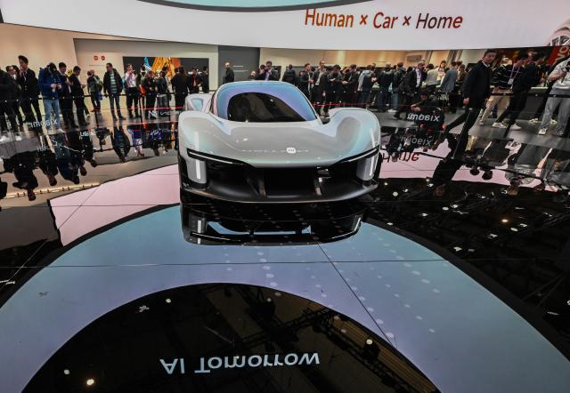 (260304) -- BARCELONA, March 4, 2026 (Xinhua) -- This photo taken on March 2, 2026 shows a car displayed at the booth of Xiaomi during the 2026 Mobile World Congress (MWC) in Barcelona, Spain.
  The 2026 Mobile World Congress (MWC) opened on Monday in Barcelona, Spain. According to its organizers, a China Pavilion has been set up at the congress for the first time, featuring major Chinese companies including China Mobile, China Unicom, Huawei, ZTE, Honor and Xiaomi, showcasing their latest advancements in mobile communications and AI technologies. (Xinhua/Cheng Min)