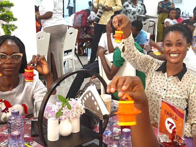 (260304) -- CAPE COAST, March 4, 2026 (Xinhua) -- Students display lanterns they made during a Lantern Festival celebration event at the University of Cape Coast in Cape Coast, capital of Ghana's Central Region, March 3, 2026. The event was held jointly by the Confucius Institute and the Luban Workshop at the University of Cape Coast on Tuesday, attracting students to participate in activities such as guessing lantern riddles, writing blessing characters, making lanterns and tasting Yuanxiao, Chinese sweet glutinous rice dumplings for celebrating the Lantern Festival. (The Confucius Institute at the University of Cape Coast/Handout via Xinhua)