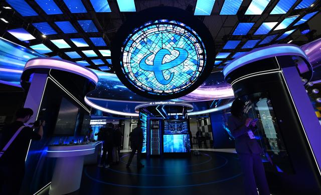 (260304) -- BARCELONA, March 4, 2026 (Xinhua) -- People visit the booth of China Telecom during the 2026 Mobile World Congress in Barcelona, Spain, March 2, 2026. The 2026 Mobile World Congress (MWC) opened on Monday in Barcelona, Spain. According to its organizers, a China Pavilion has been set up at the congress for the first time, featuring major Chinese companies including China Mobile, China Unicom, Huawei, ZTE, Honor and Xiaomi, showcasing their latest advancements in mobile communications and AI technologies. (Xinhua/Cheng Min)